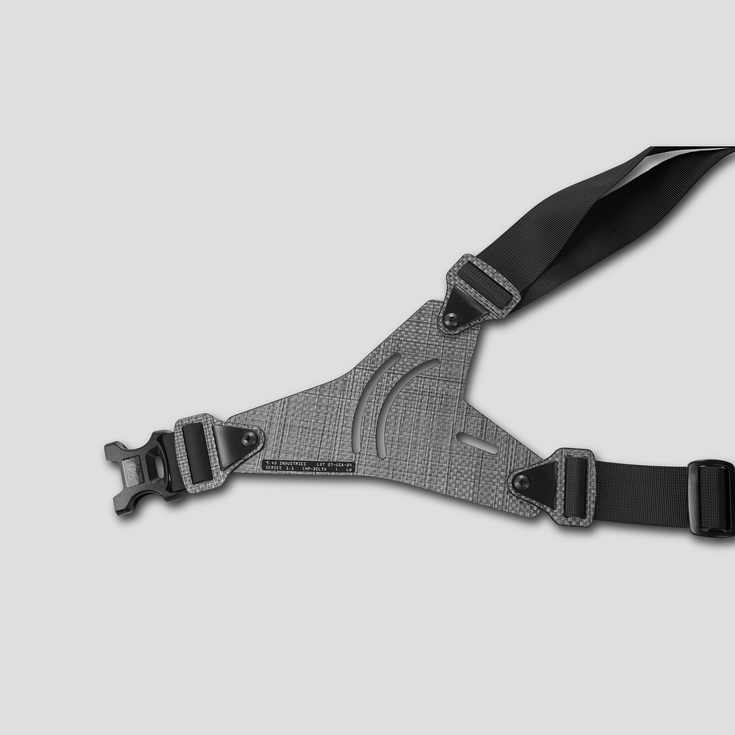 Gray shoulder holster with black straps on a light gray background