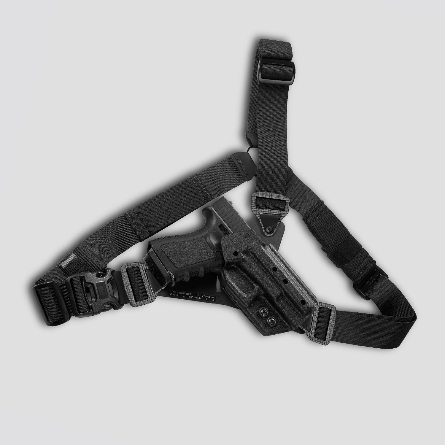 Black tactical holster with belt on a light gray background