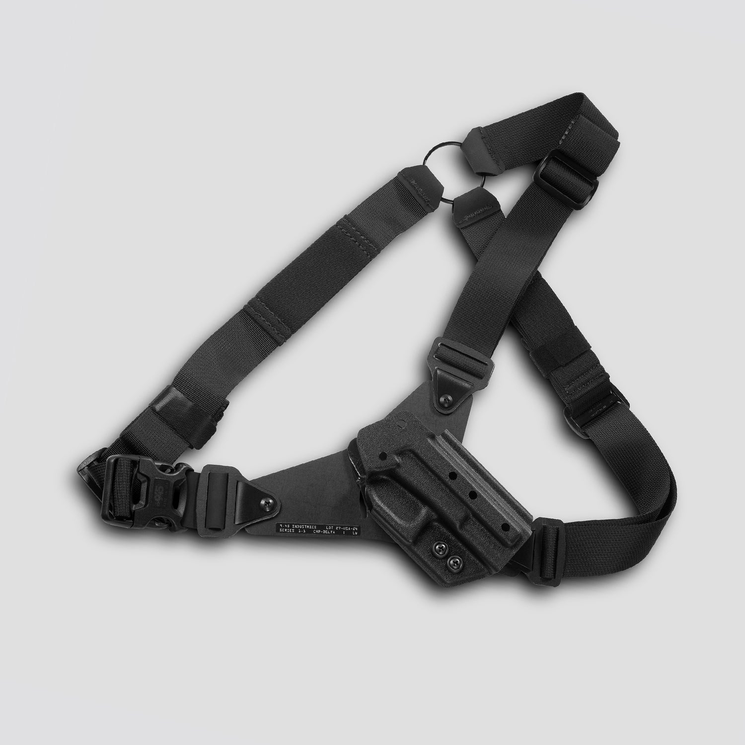Black tactical holster with shoulder strap on a light gray background
