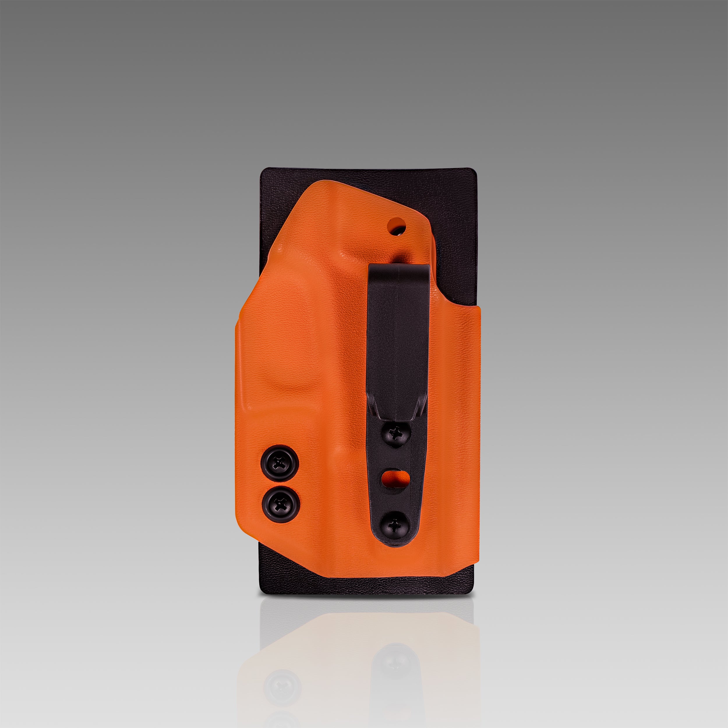 Orange and black holster on a gray background