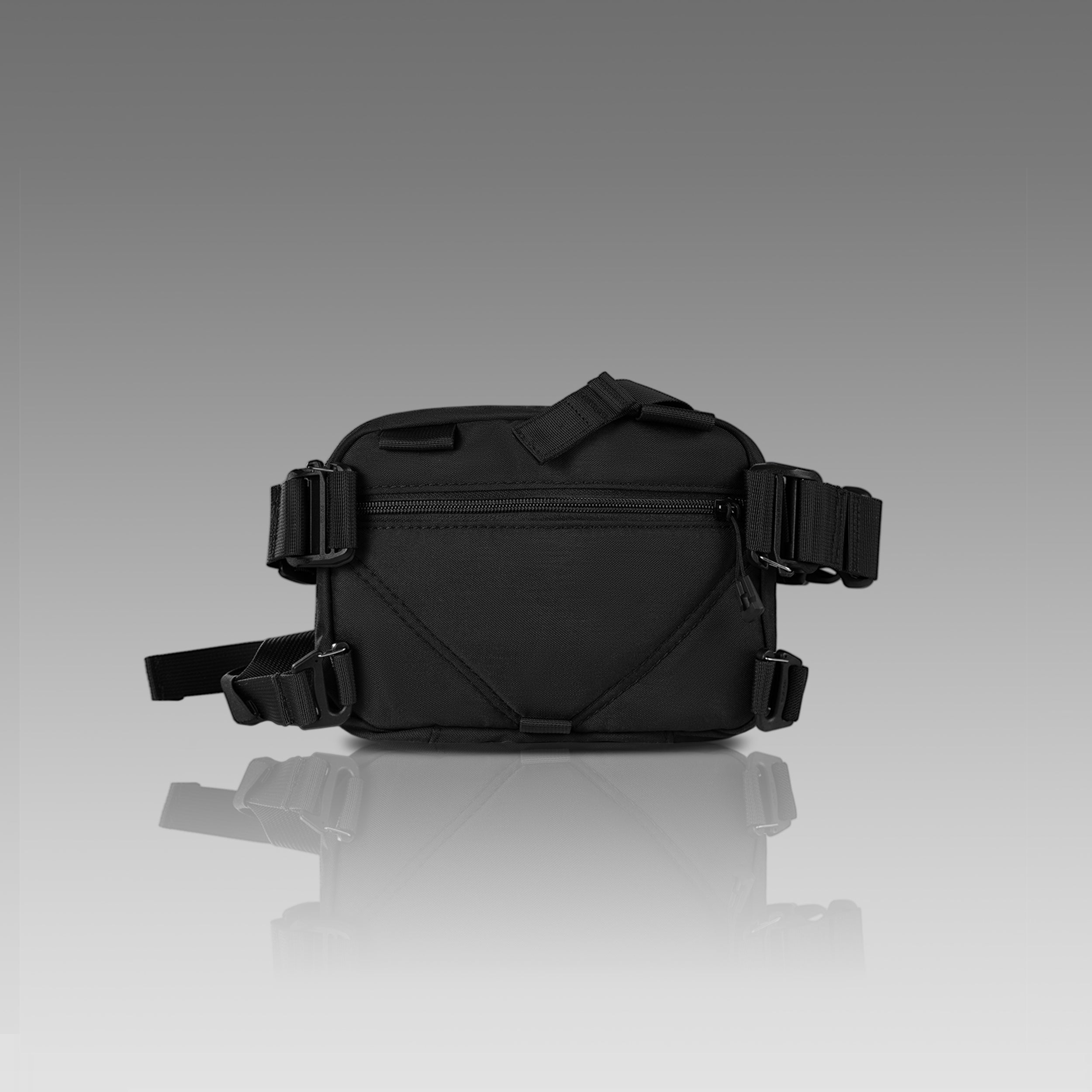 Black waist bag with multiple straps on a gray background