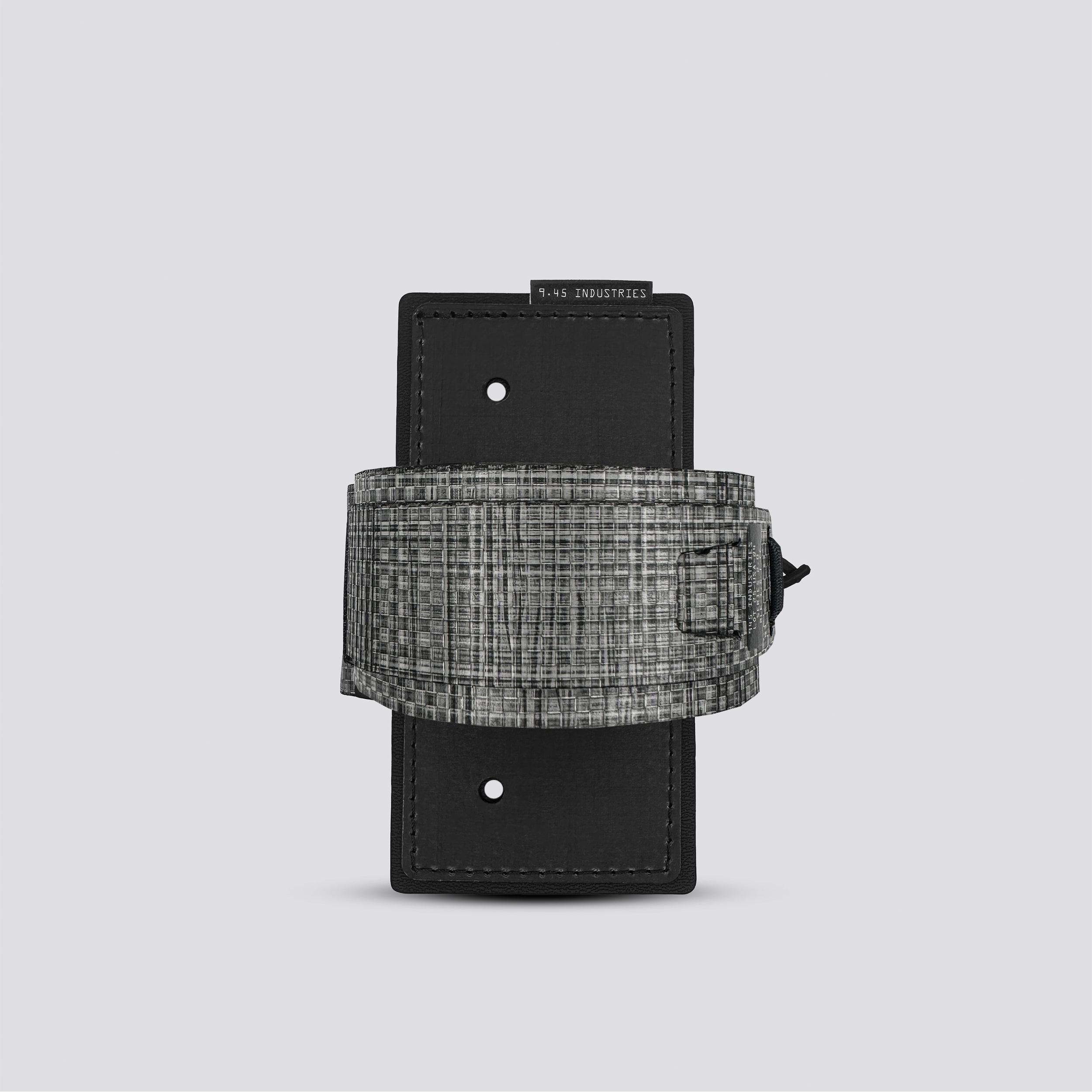 Black and gray woven leather belt on a light gray background