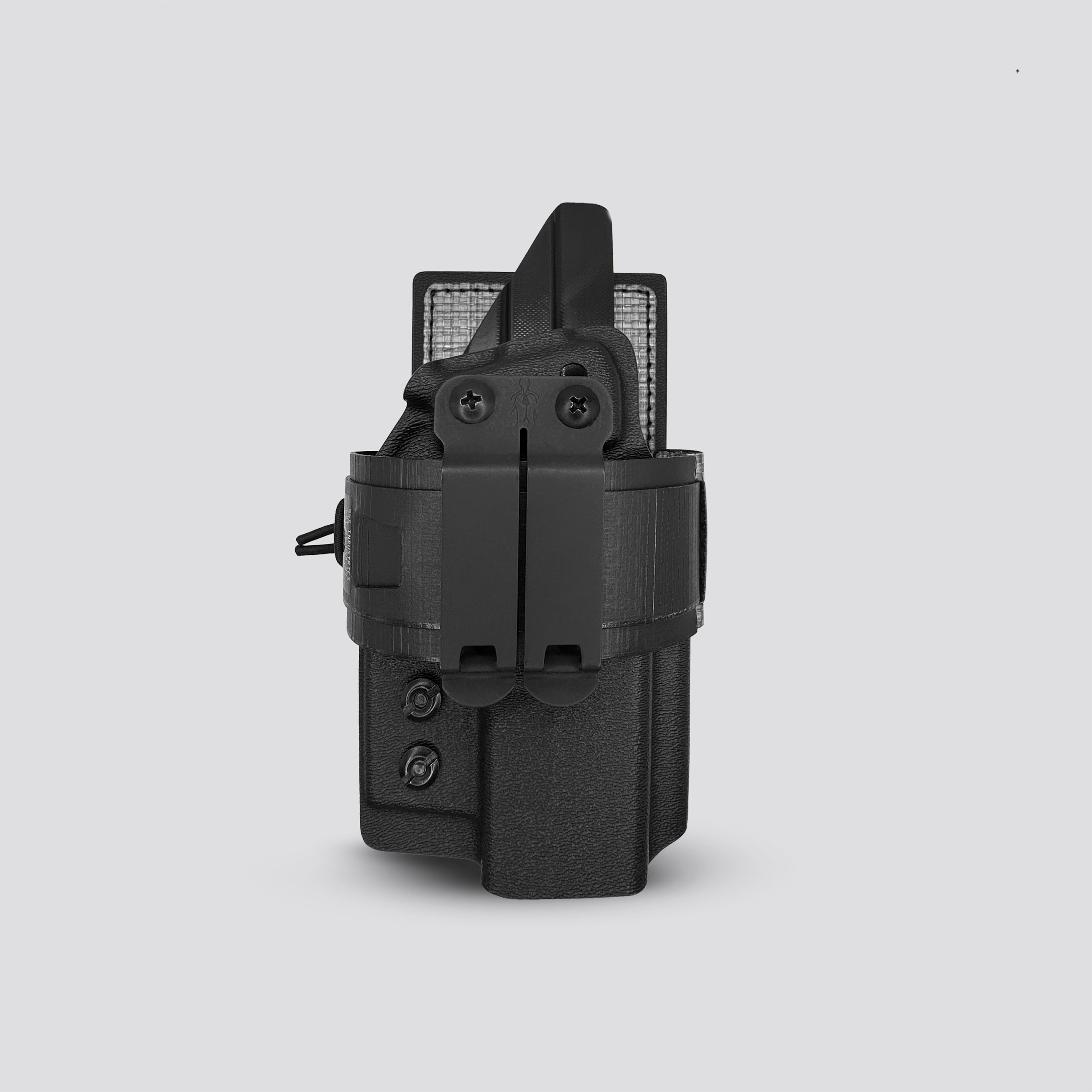 Black on titanium IWB tegris holster adapter with titanium panel and black belt with IWB holster on a light gray background