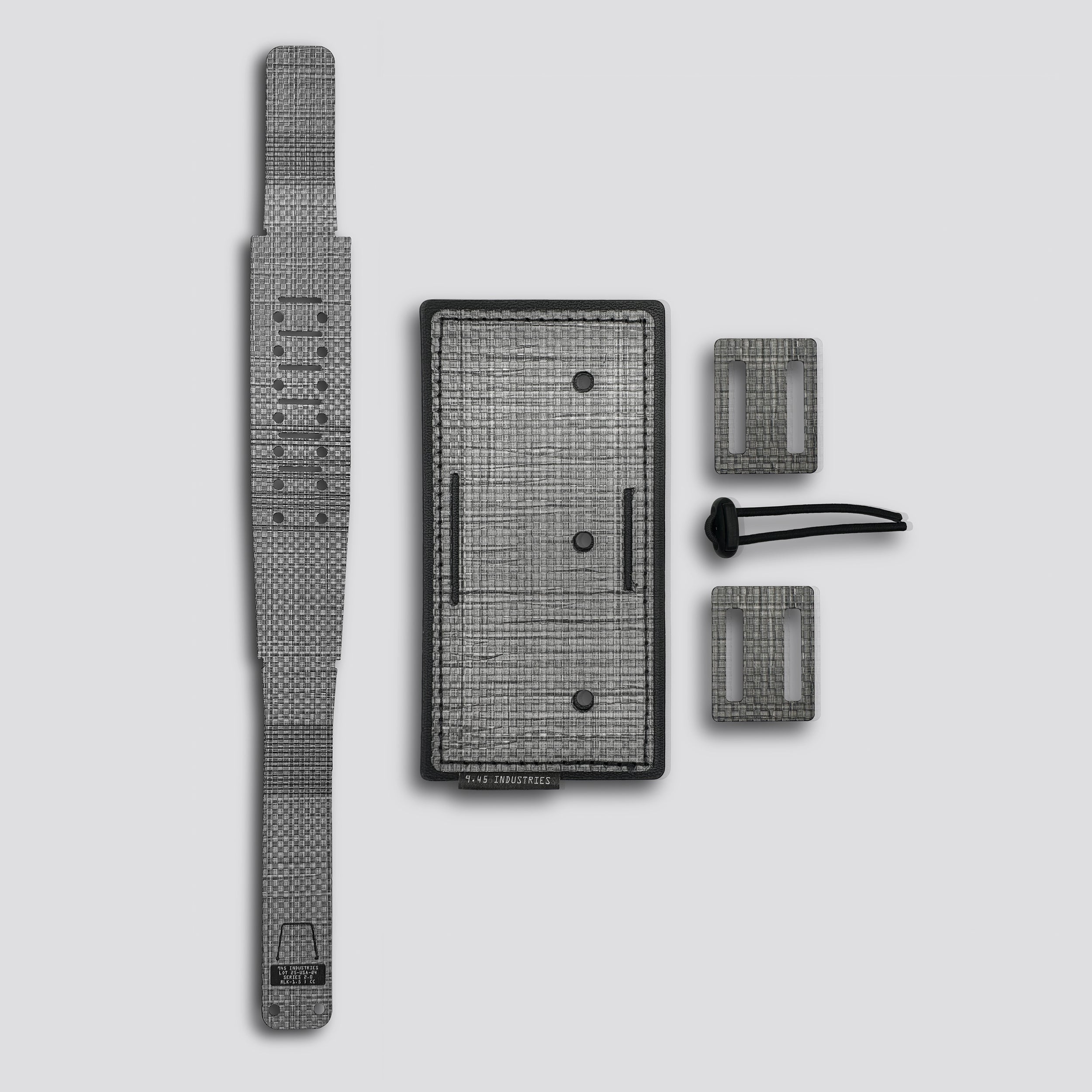 Titanium panel with two loops belt lock and locking belt on a light gray background
