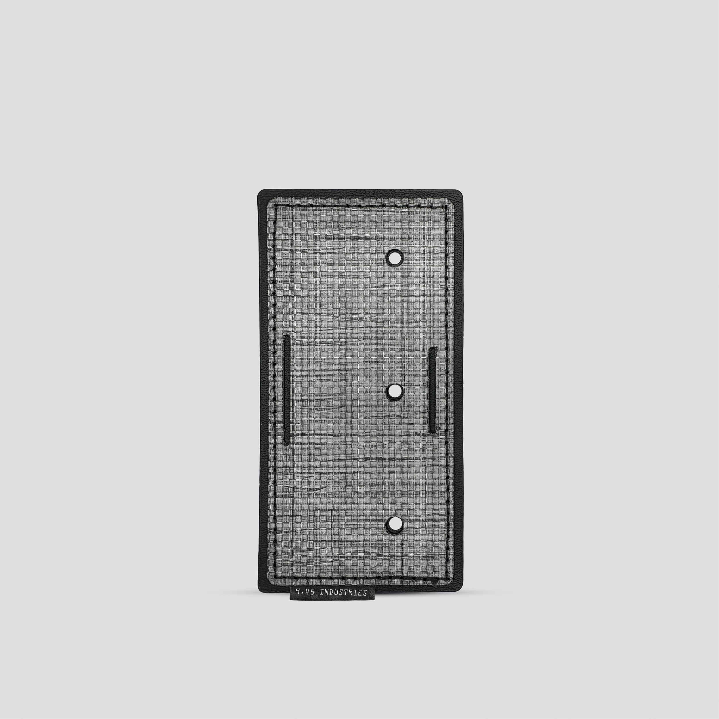 Titanium panel for IWB tegris holster adapter on a light gray background