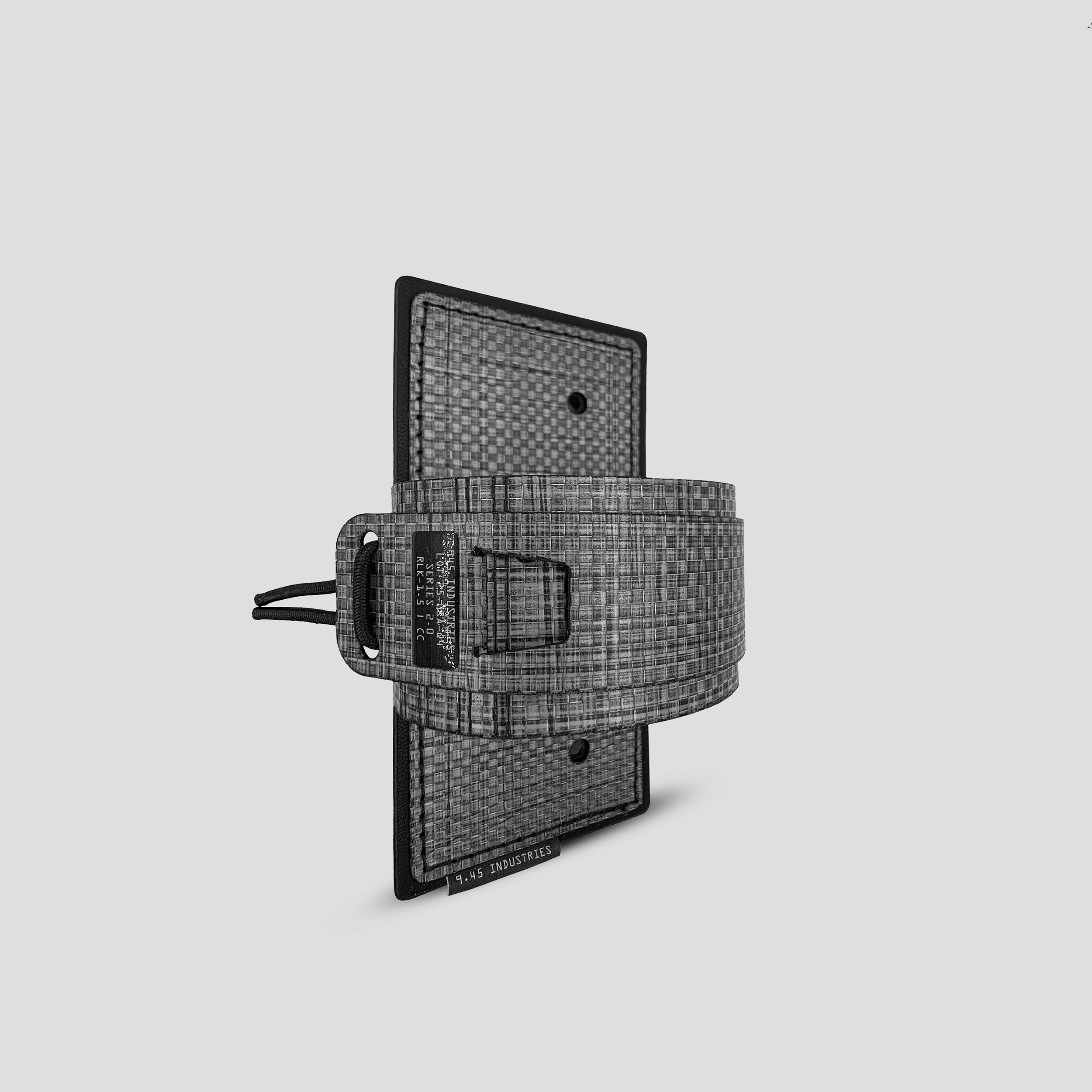 Titanium IWB tegris holster adapter with titanium panel and titanium belt on a light gray background