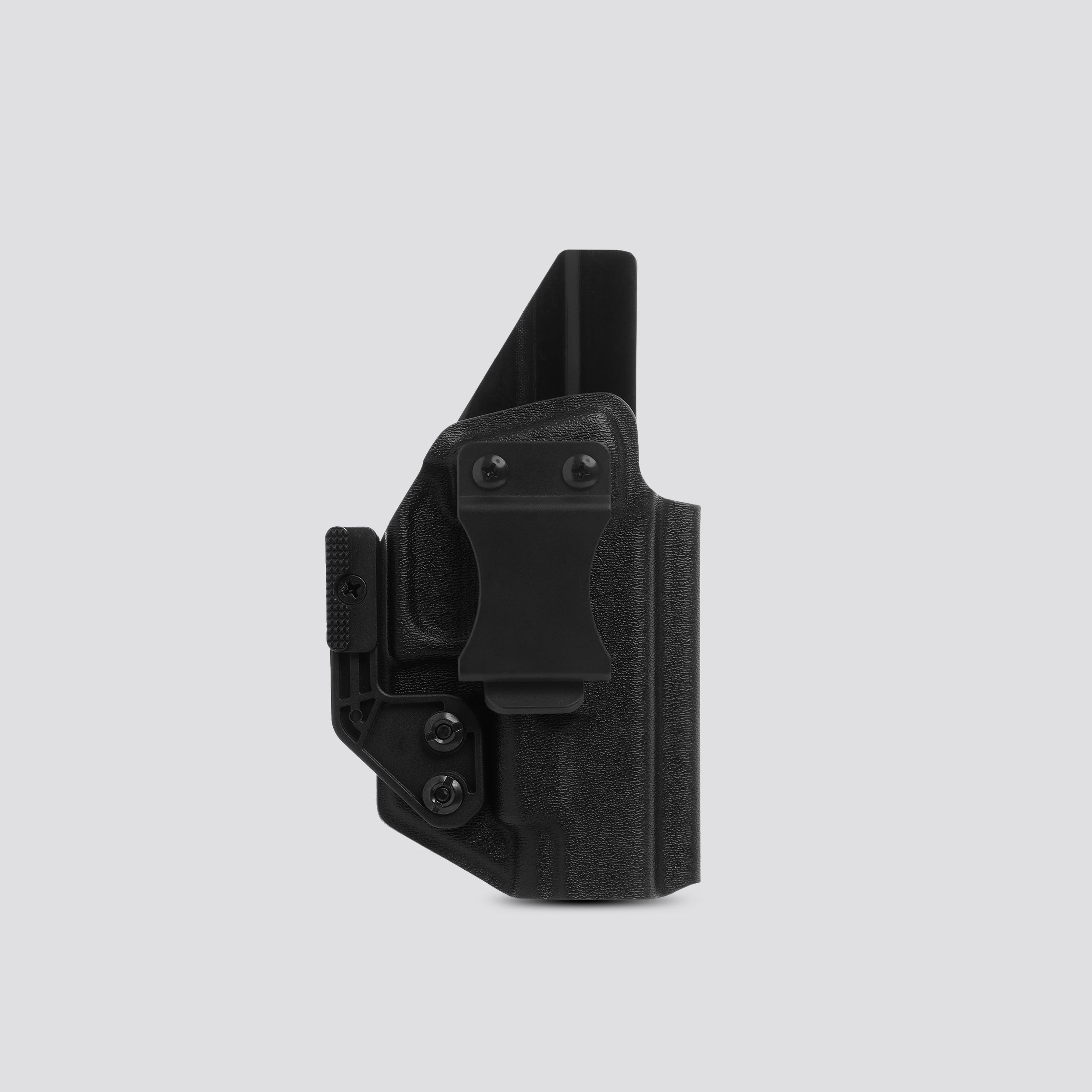 Black tactical holster on a light gray background
