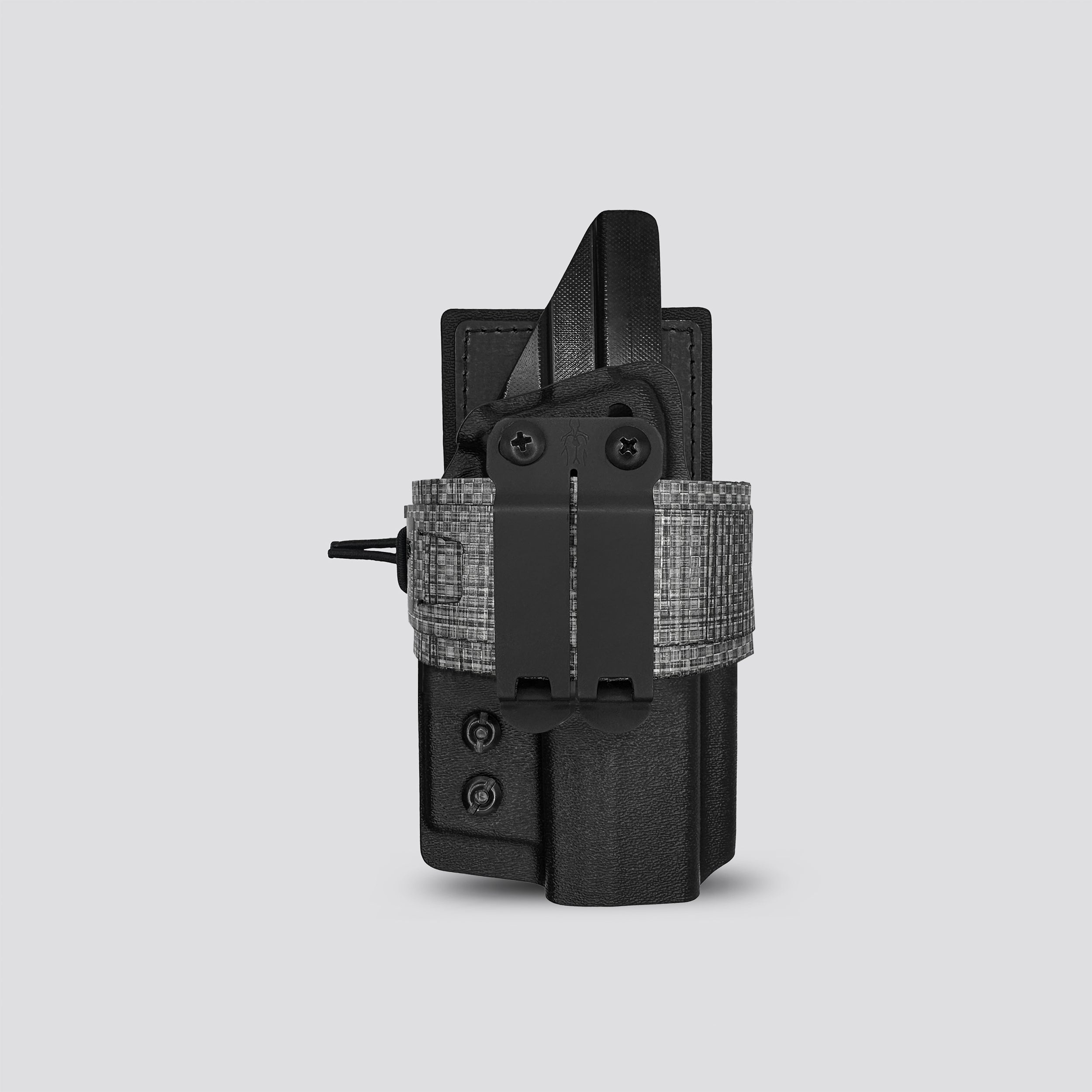 Titanium on black IWB tegris holster adapter with black panel and titanium belt with IWB holster on a light gray background