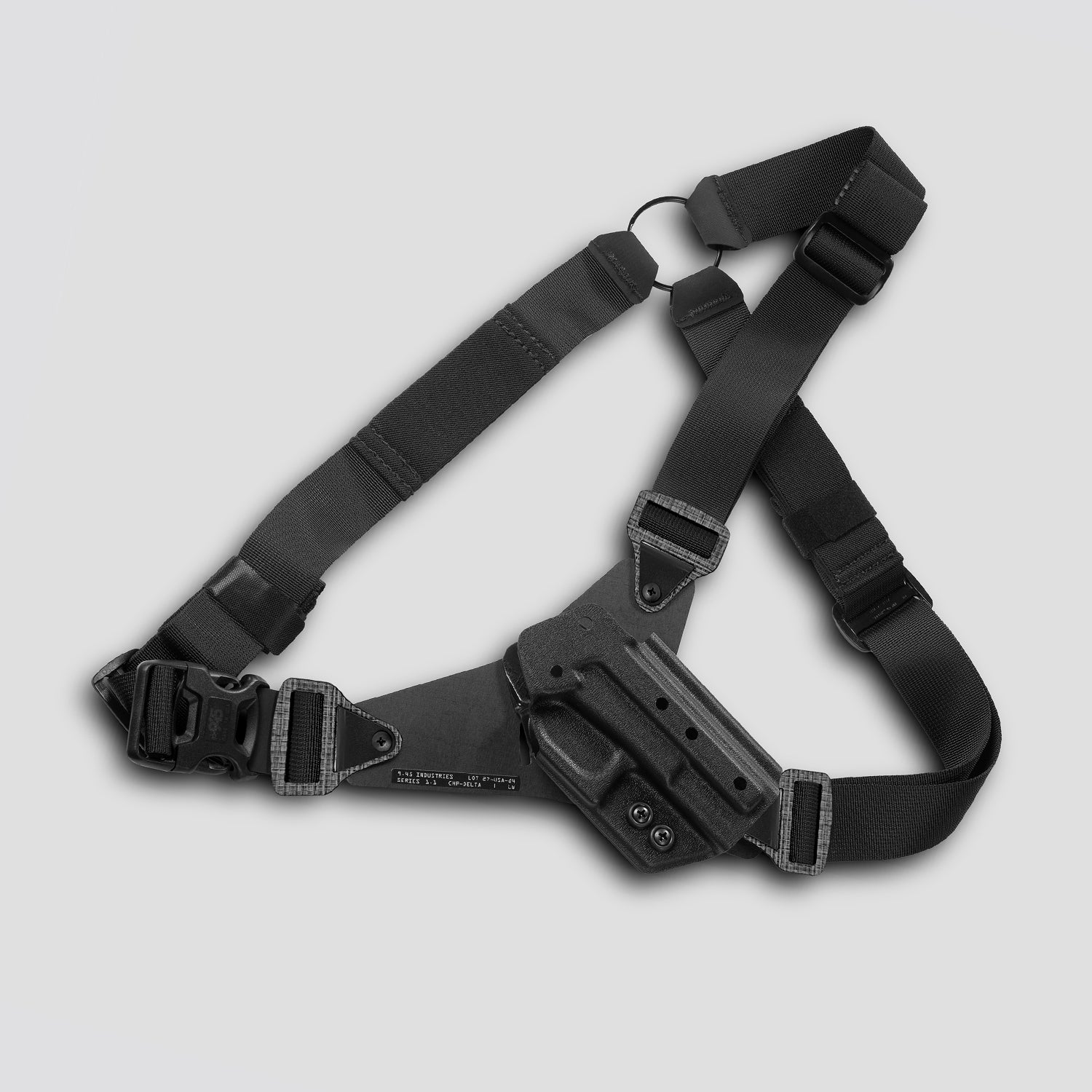Black tactical holster with shoulder strap on a light gray background