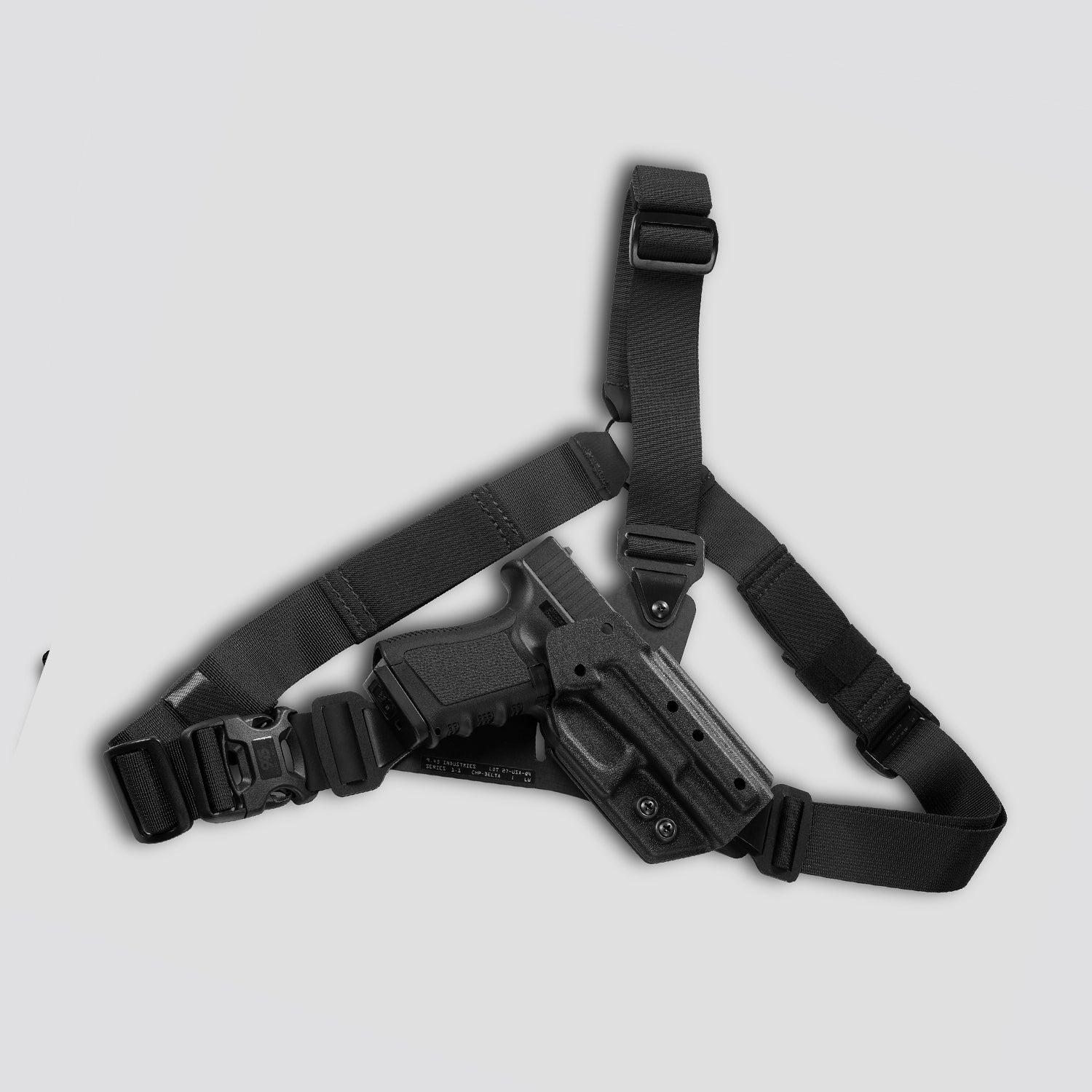 Black gun holster with belt on a light gray background