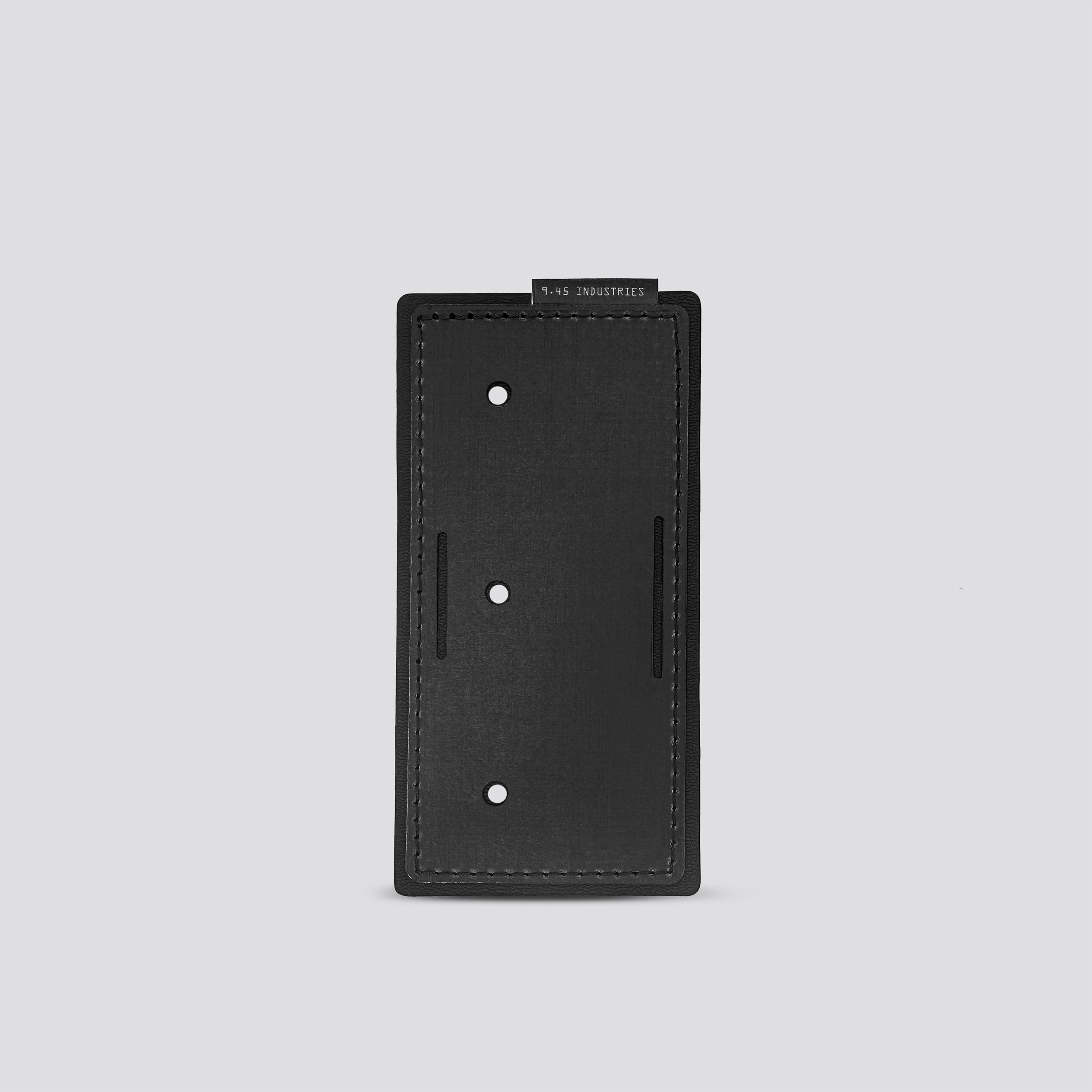black panel for IWB tegris holster adapter on a light gray background
