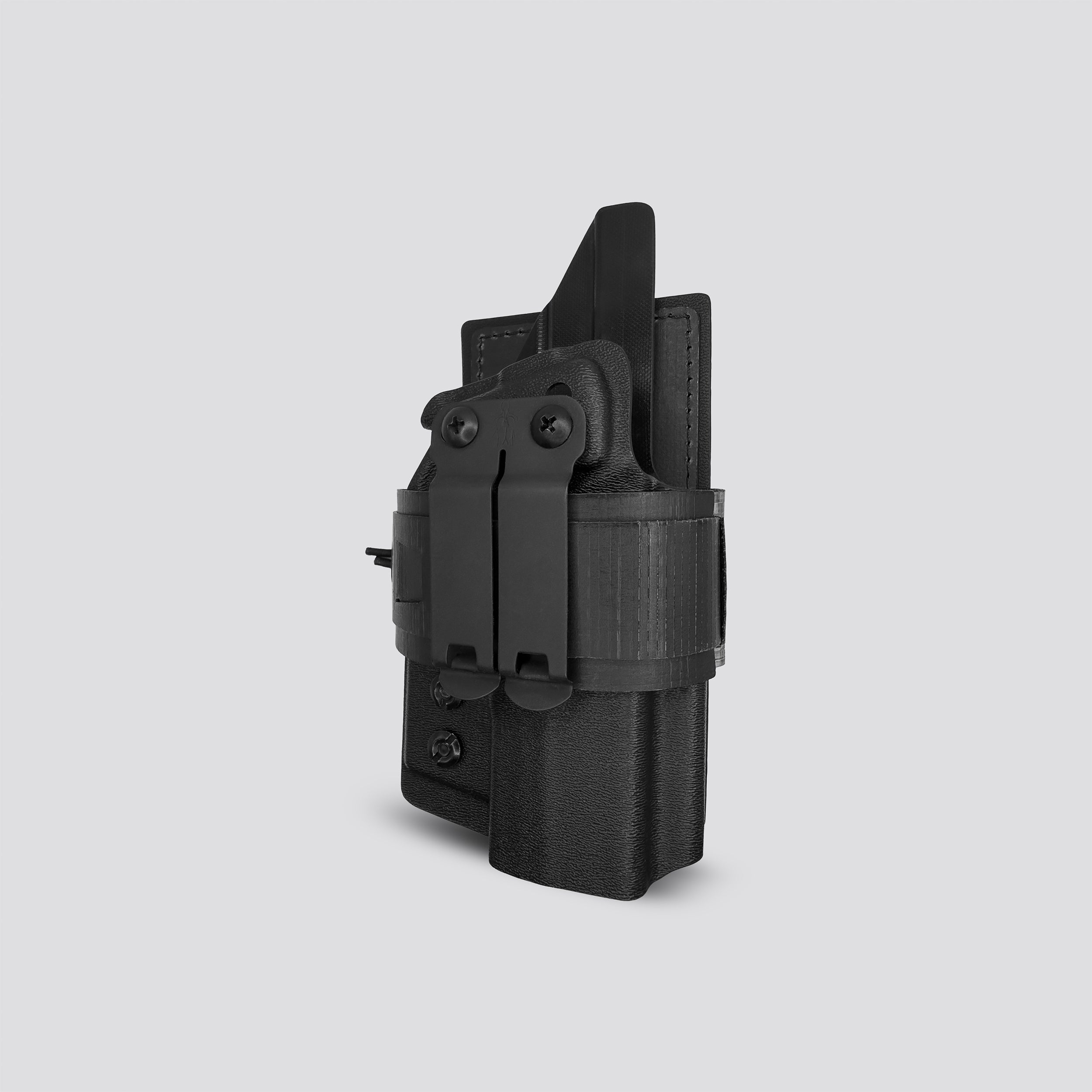 Black IWB Tegris holster adapter with black panel and belt with IWB holster on a light gray background