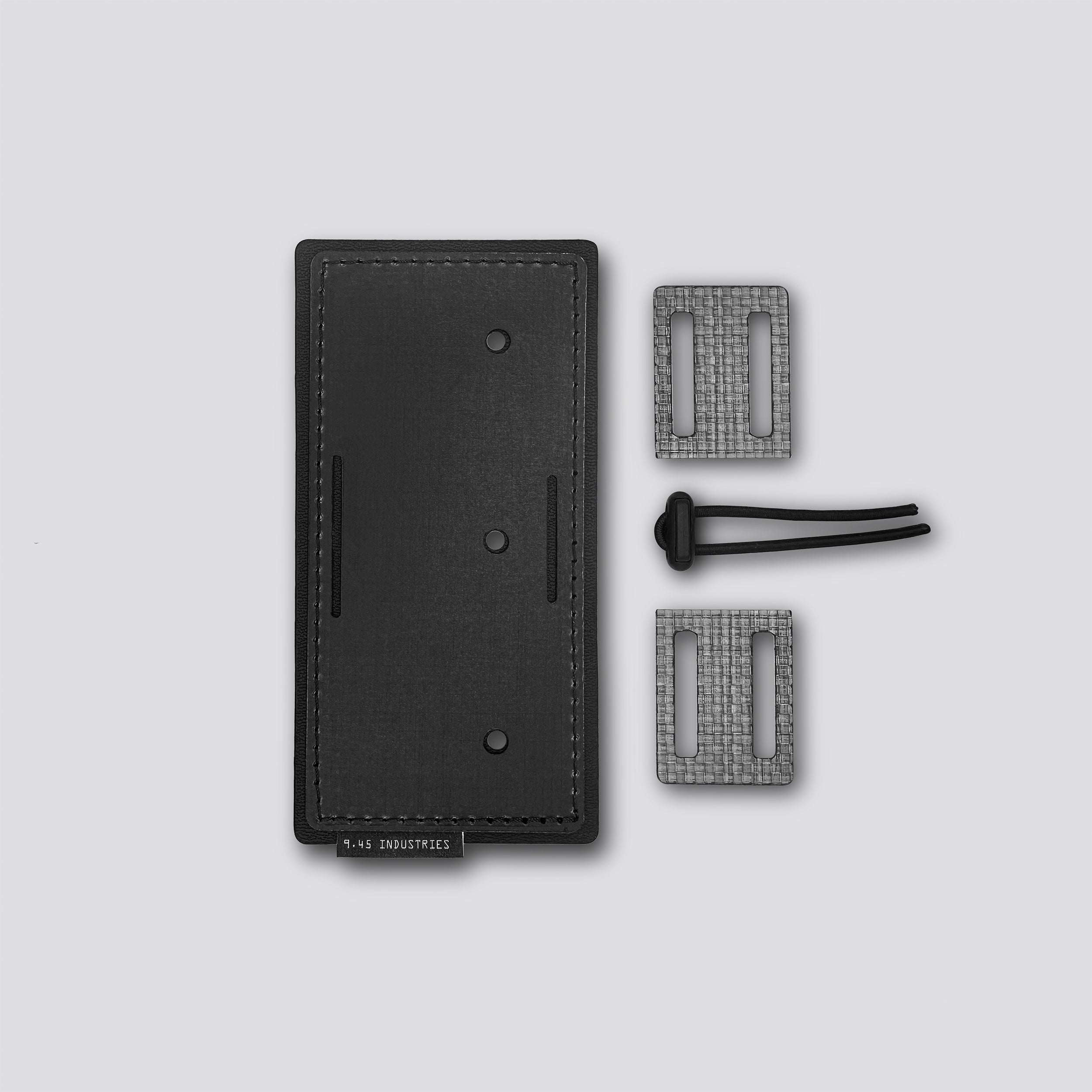 Black  panel with two loops and a belt lock on a light gray background